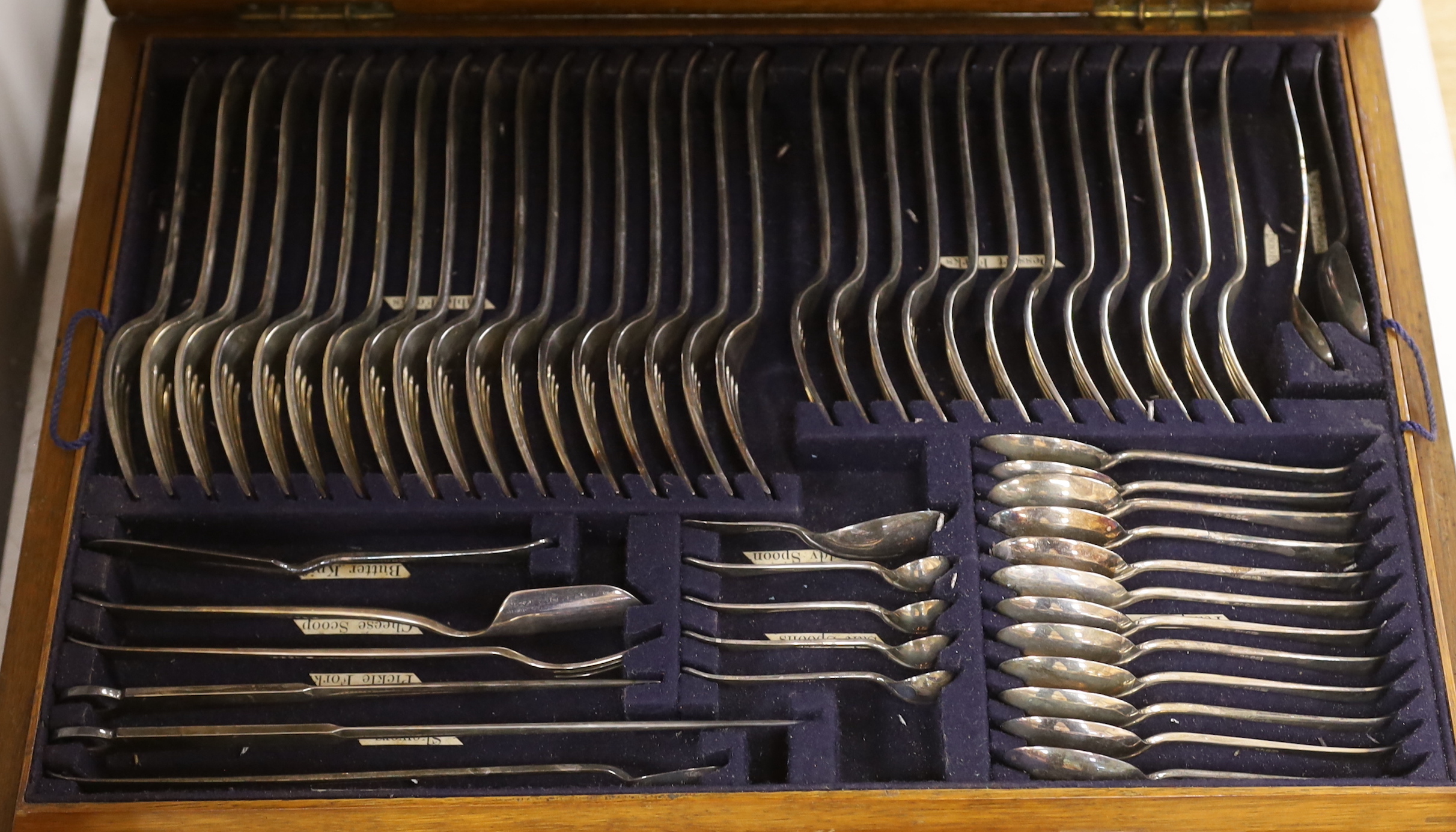 An oak canteen of plated suite of cutlery